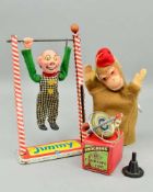 AN ARNOLD TINPLATE JIMMY ACROBATIC CLOWN, plastic doll missing one hand and has some damage to