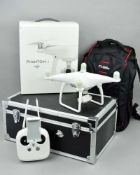A D.J.I. PHANTOM 4 QUADCOPTER DRONE, not tested, appears complete with all original essential