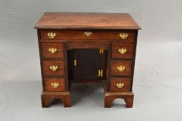 A GEORGE III MAHOGANY KNEE-HOLE DESK, the rectangular top with moulded edge above a single long