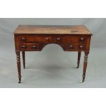 AN EARLY VICTORIAN MAHOGANY DRESSING TABLE, the rectangular top above an arrangement of four