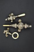 A VICTORIAN SILVER BABY'S RATTLE, with whistle, bells and mother of pearl handle, Birmingham 1881,