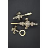 A VICTORIAN SILVER BABY'S RATTLE, with whistle, bells and mother of pearl handle, Birmingham 1881,