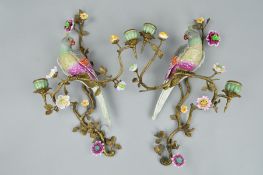 A PAIR OF 20TH CENTURY GILT METAL AND PORCELAIN TWIN BRANCH WALL SCONCES, mounted with parakeets and