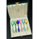 A CASED SET OF SIX KRISTIAN HESTENES OF NORWAY HARLEQUIN ENAMELLED COFFEE SPOONS, stamped