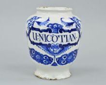 A DELFT DRUG JAR, inscribed 'U: NICOTIAN' within a scrolled border surmounted by two angels, with