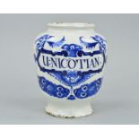 A DELFT DRUG JAR, inscribed 'U: NICOTIAN' within a scrolled border surmounted by two angels, with