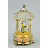 A REUGE MUSIC SAINTE CROIX REPRODUCTION AUTOMATON SINGING BIRD IN A CAGE, the cage with Capo di