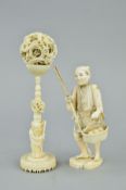 A LATE 19TH CENTURY JAPANESE IVORY OKIMONO OF A MAN, carrying a bamboo staff in his right hand and a