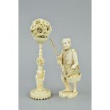 A LATE 19TH CENTURY JAPANESE IVORY OKIMONO OF A MAN, carrying a bamboo staff in his right hand and a