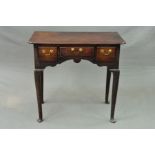 A GEORGE III OAK SIDE TABLE, of rectangular form, fitted with three frieze drawers above a wavy