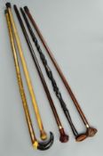 A COLLECTION OF WALKING STICKS AND CANES, including a silver mounted hound head stick, makers Comyns