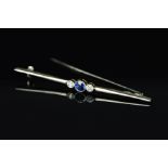 AN EARLY 20TH CENTURY SAPPHIRE AND DIAMOND BAR BROOCH, one round mixed cut blue sapphire measuring