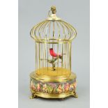 A REUGE MUSIC SAINTE CROIX REPRODUCTION AUTOMATON SINGING BIRD IN A CAGE, the cage with Capo di