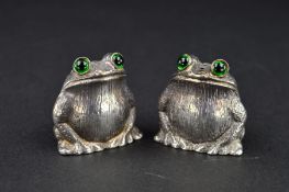 A PAIR OF ELIZABETH II NOVELTY SILVER FROG/TOAD SALT AND PEPPER POTS, green glass eyes, makers