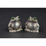 A PAIR OF ELIZABETH II NOVELTY SILVER FROG/TOAD SALT AND PEPPER POTS, green glass eyes, makers
