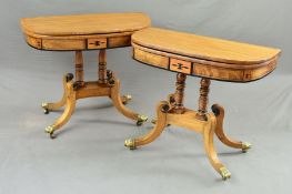 A NEAR PAIR OF REGENCY WALNUT, BRASS AND EBONY INLAID FOLD OVER 'D' SHAPE CARD TABLES, green baize