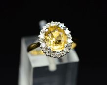 A MID 20TH CENTURY GOLDEN TOPAZ AND DIAMOND OVAL CLUSTER RING, oval mixed cut topaz measuring