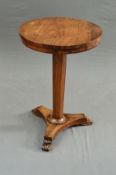 AN EARLY VICTORIAN ROSEWOOD OCCASIONAL TABLE, the circular top on a tapered octagonal column to a