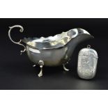 A LATE VICTORIAN SILVER VESTA CASE, of rounded rectangular form, foliate engraved decoration,