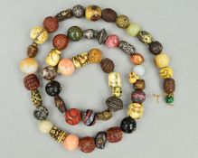 A STRING OF FIFTY-ONE 19TH/20TH CENTURY JAPANESE OJIME BEADS IN WOOD, HORN, HARDSTONE, PORCELAIN,