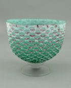 PAUL BARCROFT, a Studio glass bowl over a knopped stem and conical foot, the textured body being