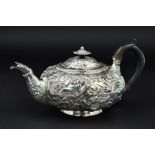 A GEORGE IV SILVER TEAPOT, of flattened circular form, flower head shaped finial above hinged