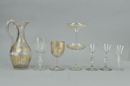 A PAIR OF GEORGE III FACET CUT STEM CORDIAL GLASSES, the bowls engraved with an exotic bird and