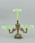 AN ART NOUVEAU GILT METAL AND VASELINE GLASS EPERGNE, central trumpet with wavy rim, above two