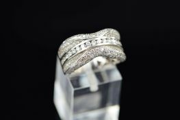 A MODERN 18CT WHITE GOLD PAVE DIAMOND SET BAND RING, encrusted with modern round brilliant cut