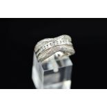 A MODERN 18CT WHITE GOLD PAVE DIAMOND SET BAND RING, encrusted with modern round brilliant cut