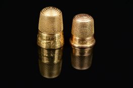 A CHARLES HORNER 15CT GOLD THIMBLE, scroll design, measuring approximately 24mm in height,