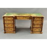 A VICTORIAN BURR WALNUT DESK, of inverted breakfront form, tooled green leather inset top above a