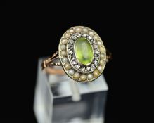 A 19TH CENTURY PERIDOT, DIAMOND AND SEED PEARL RING, an oval cluster measuring approximately 17.