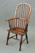A 19TH CENTURY STAINED ASH WINDSOR HOOP AND SPINDLE BACK ARMCHAIR, dished seat, turned legs and '