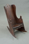 A 19TH CENTURY STAINED BEECH CHILD'S ROCKING CHAIR, of shepherd's chair design, height 71cm