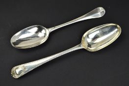 A GEORGE III SILVER OLD ENGLISH FEATHERED AND CARTOUCHE HANDLE TABLESPOON, makers mark partially