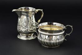 A LATE VICTORIAN SILVER PORRINGER, in an early 18th Century style, 'S' scroll handles, repousse