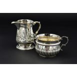 A LATE VICTORIAN SILVER PORRINGER, in an early 18th Century style, 'S' scroll handles, repousse