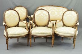 A LATE 19TH CENTURY SALON SUITE, of Louis XVI style, comprising a canape and four fauteuils, each