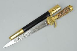 A 20TH CENTURY GERMAN HUNTING DAGGER, the blade etched to the top edge with foliate design both
