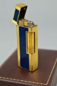 A DUNHILL LIGHTER, the lighter with engine turned decoration and a central blue enamel panel,