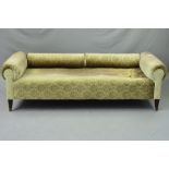 AN EARLY 20TH CENTURY GERMAN DAY BED, scrolled ends, with a pair of bolster cushions which can act