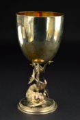 A VICTORIAN SILVER AND SILVER GILT GOBLET, circular bowl on a trident pedestal, encircled by a