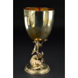 A VICTORIAN SILVER AND SILVER GILT GOBLET, circular bowl on a trident pedestal, encircled by a