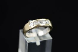 A MODERN 18CT GOLD DIAMOND ETERNITY STYLE RING, five princess cut diamonds channel set totalling