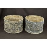 A PAIR OF CIRCULAR LEAD PLANTERS, the exteriors cast with foliate scrolls, flower heads and