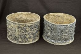 A PAIR OF CIRCULAR LEAD PLANTERS, the exteriors cast with foliate scrolls, flower heads and