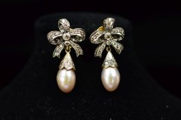 A PAIR OF DIAMOND AND CULTURED PEARL DROP EARRINGS, featuring a fancy bow top suspending a tear drop