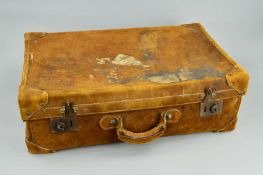 A VINTAGE BROWN SUEDE SUITCASE BY THE NORTH WEST TANNERY CO LTD, CAWNPORE, worn/torn luggage