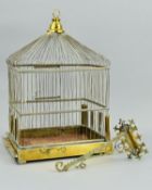 A LATE VICTORIAN BRASS BIRD CAGE, of rectangular form, central hanging loop on domed top, height